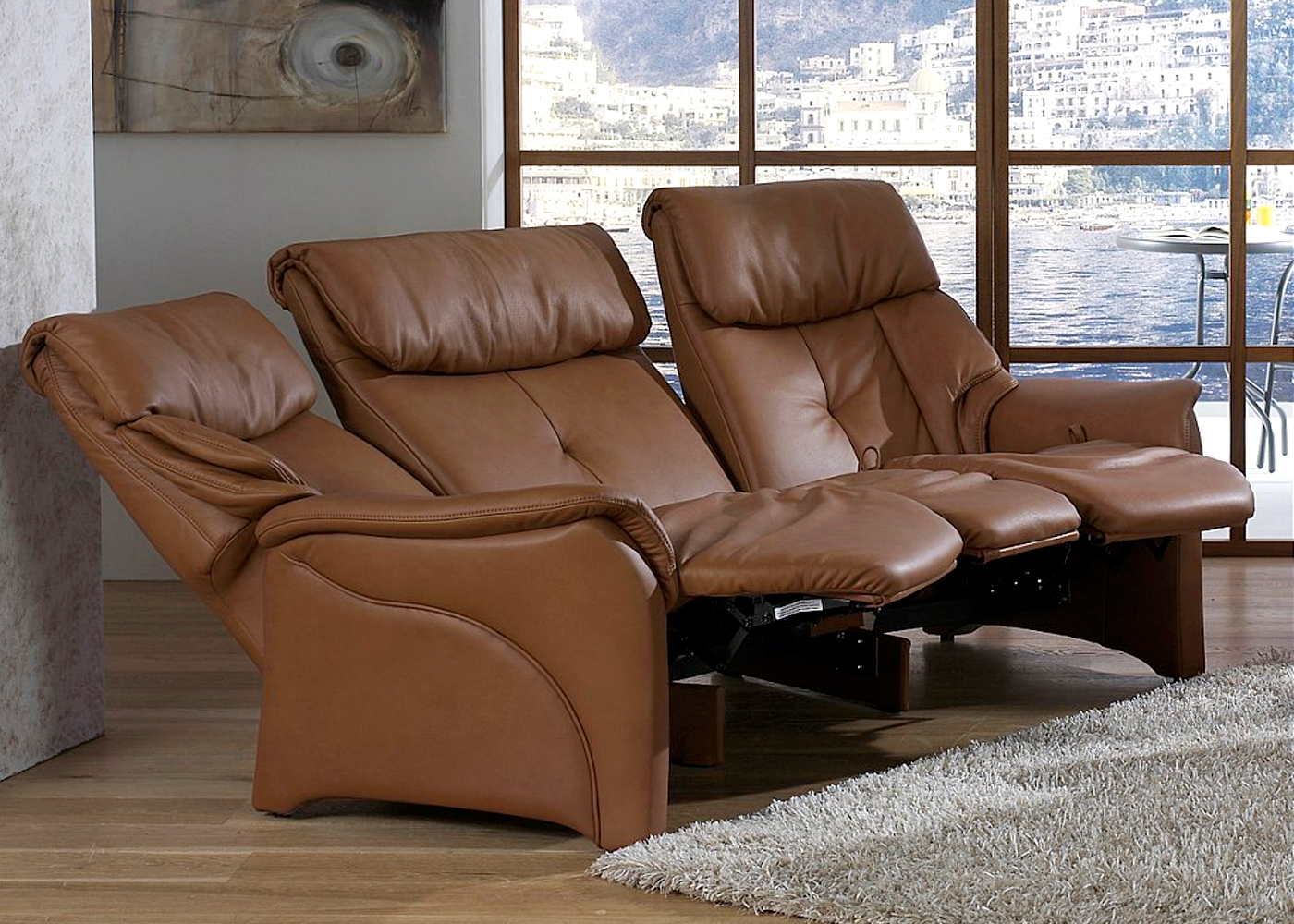 small orange curved leather reclining sofa
